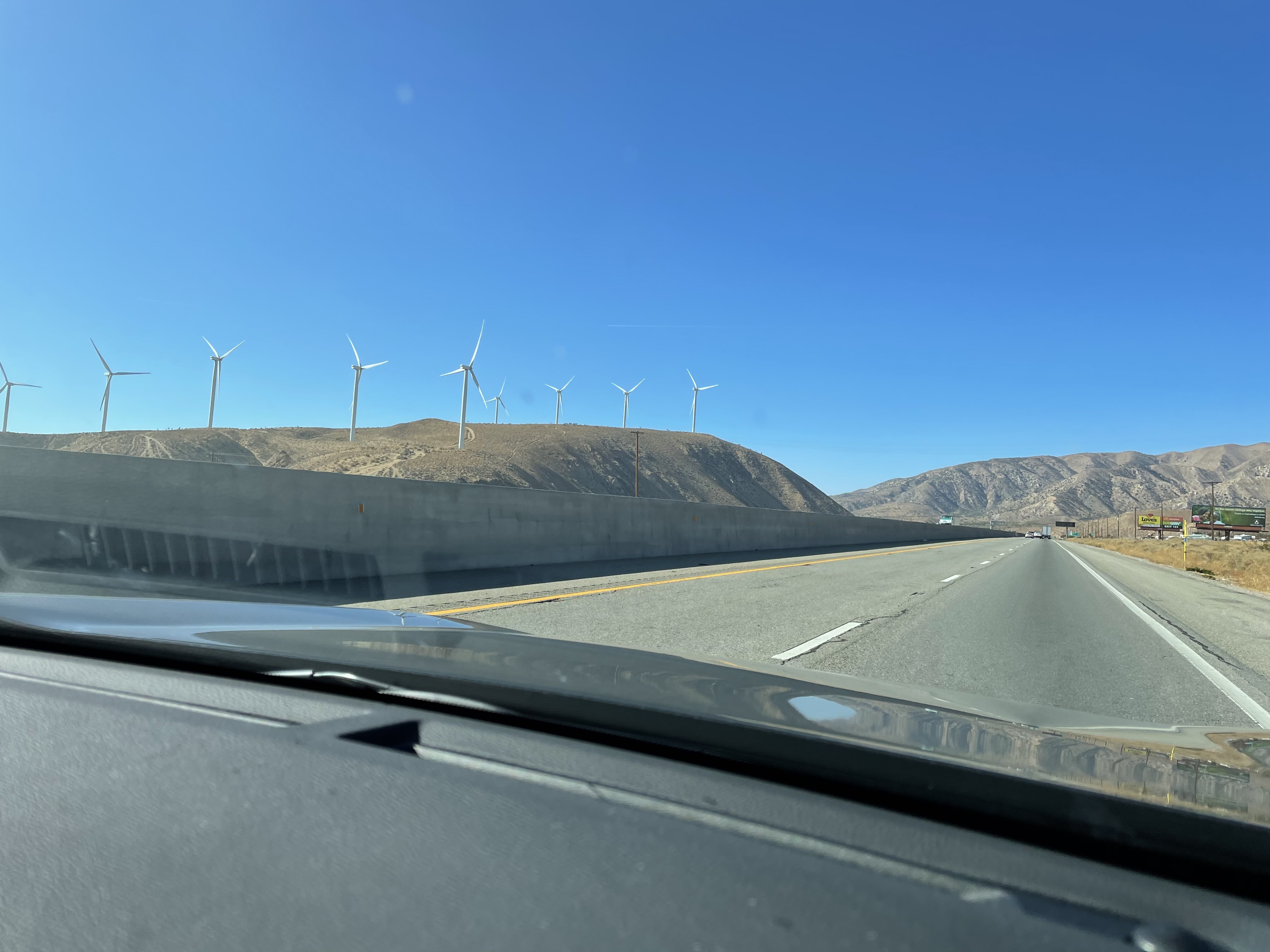 Photo — wind turbines scattered across the landscape